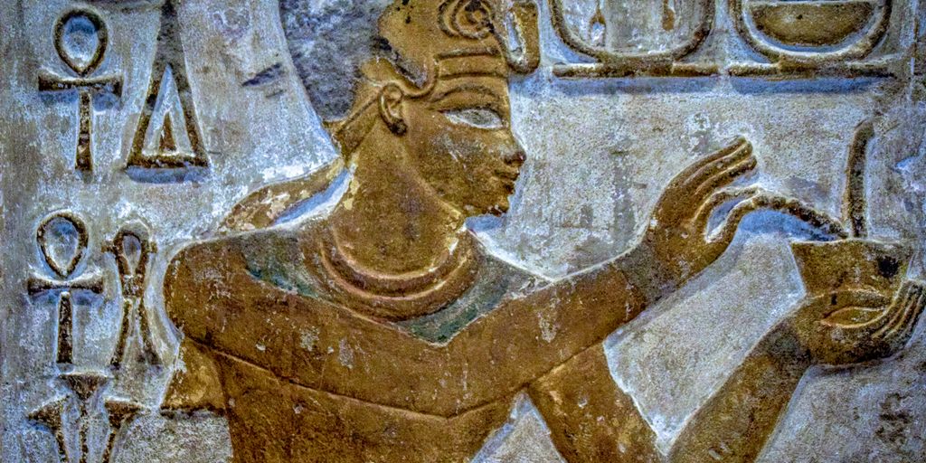 brown concrete statue of man