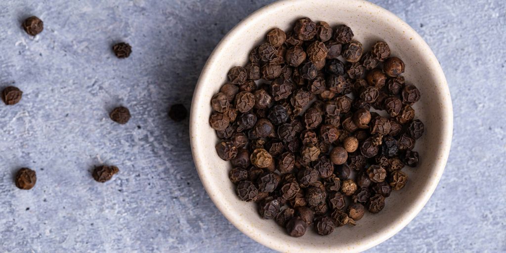 brown coffee beans on white ceramic bowl