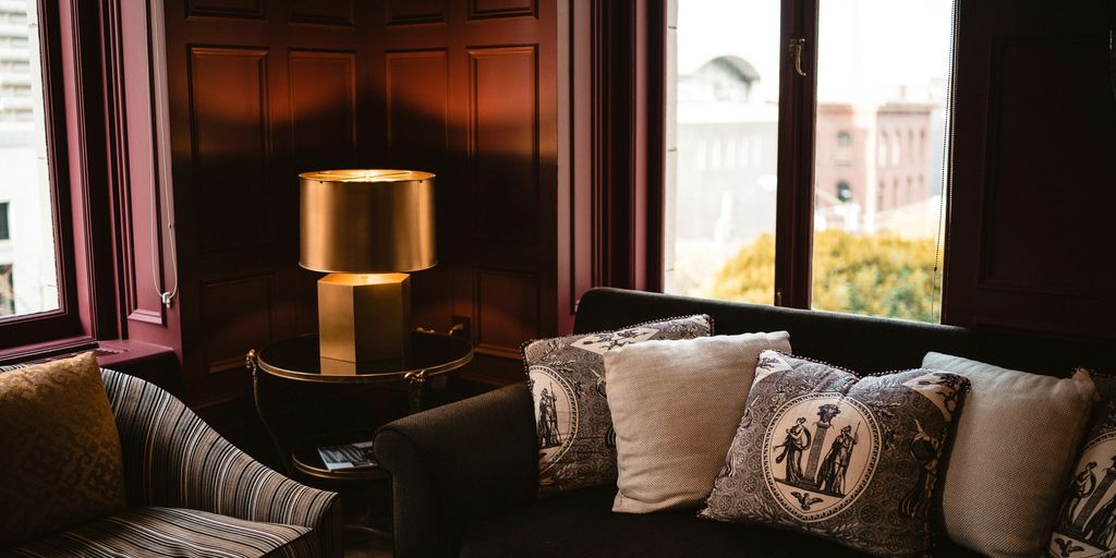 two sofa near windows