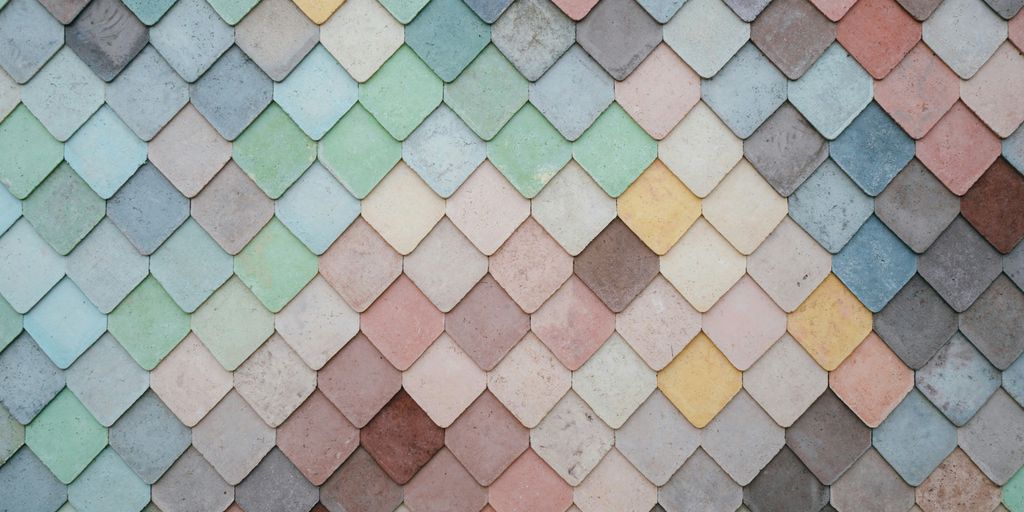 a multicolored tile wall with a pattern of small squares