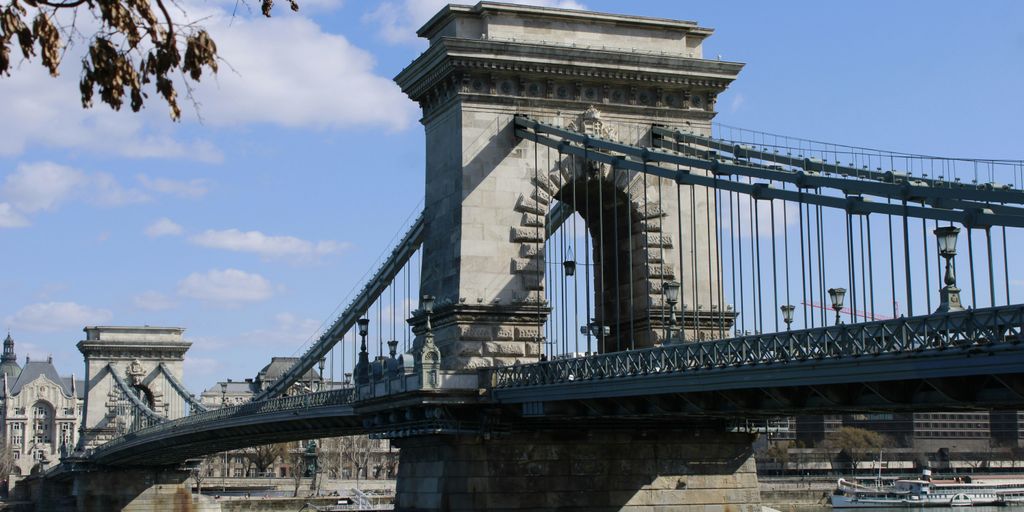 gray concrete bridge under blue sky during daytime
