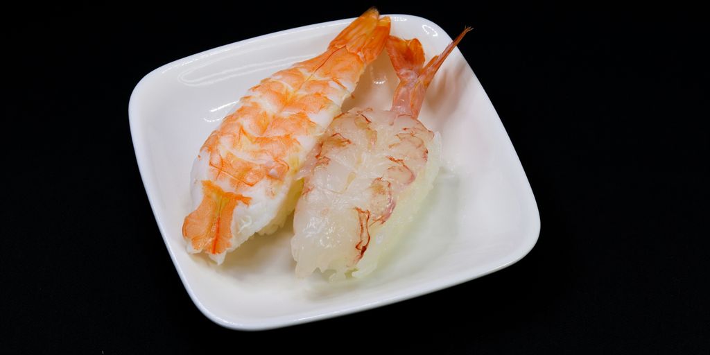white and yellow shrimp on white ceramic plate