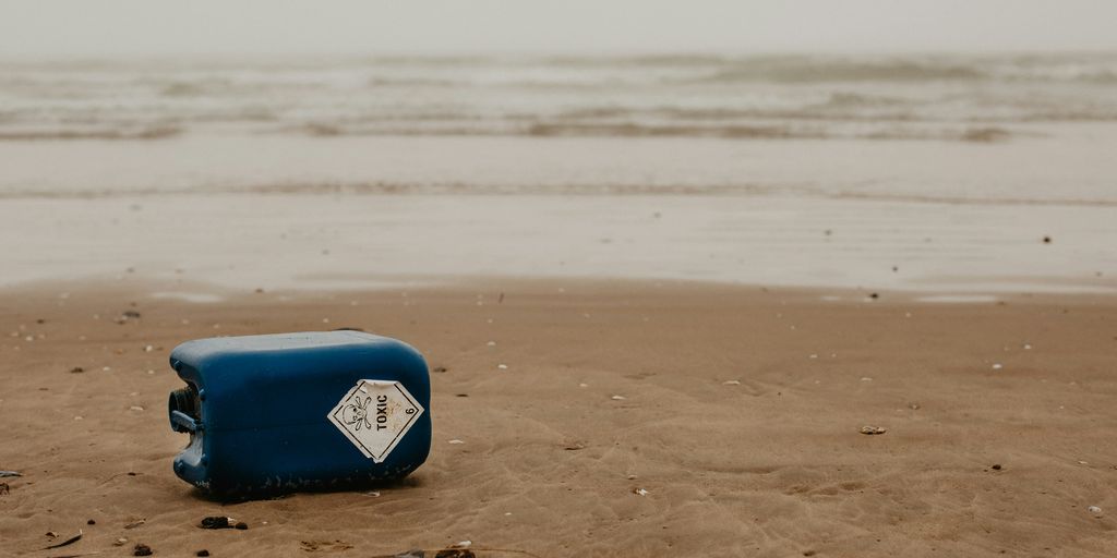 blue and white surfboard on beach during daytime