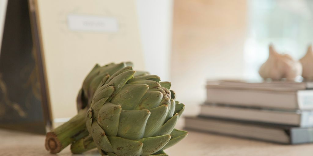 green flower bud on brown wooden table