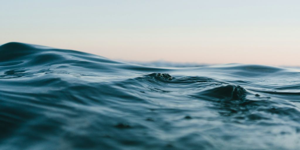 body of water under sky